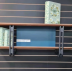 Wall mounted stylish shelf perfect for photos and books